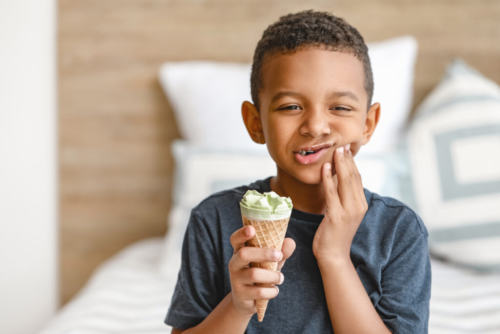 Boy with cold sensitive teeth.