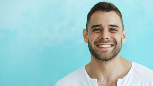 Man smiling after teeth whitening in Reno
